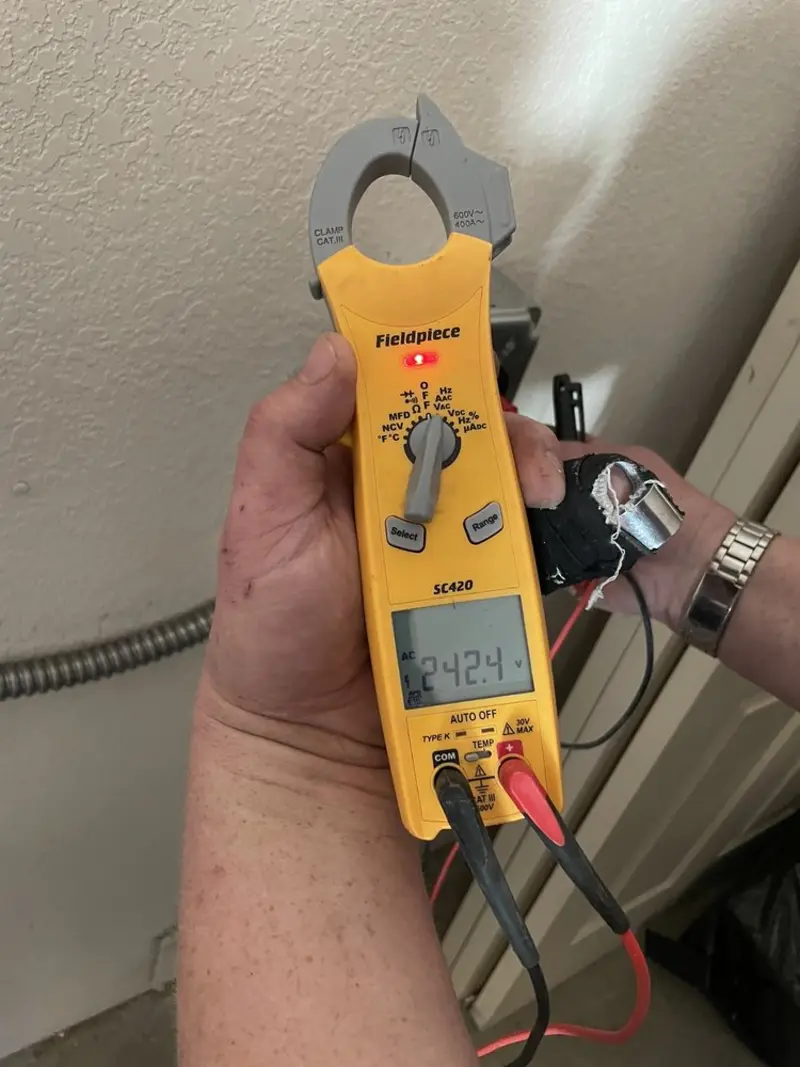 Voltage testing with clamp meter during Recessed Lighting Installation in Islip